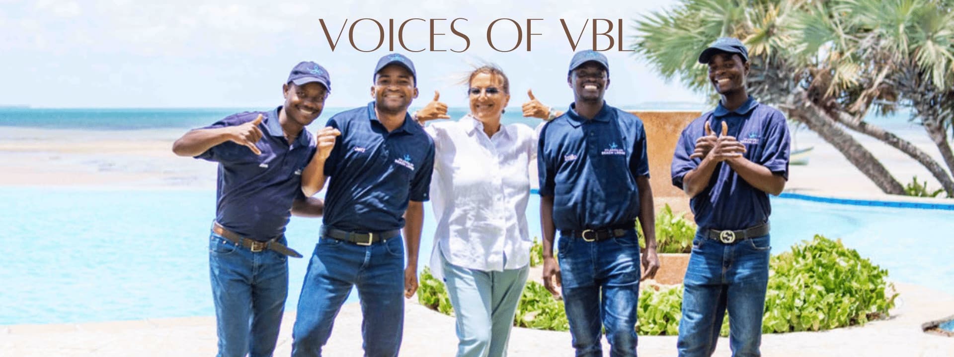 The Voices of VBL: the team together beside the infinity pool